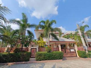 Exterior of a residential home with palm trees