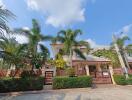 Exterior of a residential home with palm trees