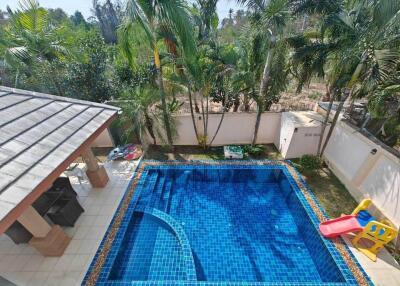 Outdoor area with swimming pool and slide