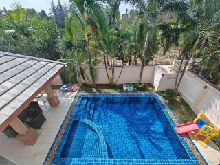 Outdoor area with swimming pool and slide