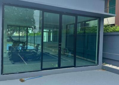 modern outdoor gym with large glass doors