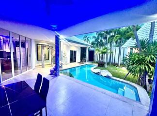 Covered patio with pool and garden view