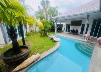 Outdoor view with swimming pool and garden