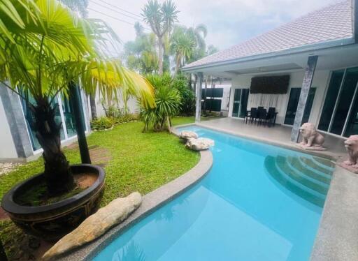 Outdoor view with swimming pool and garden