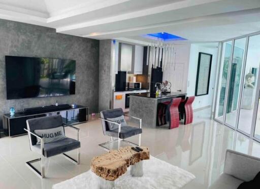 Modern living room with open kitchen