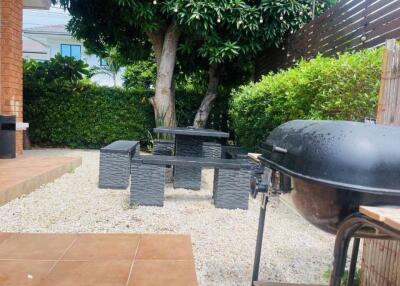 Outdoor area with garden, barbecue and picnic table