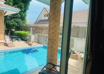 View of the patio and pool area from inside the house