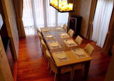 Elegant dining room with wooden floor and large table