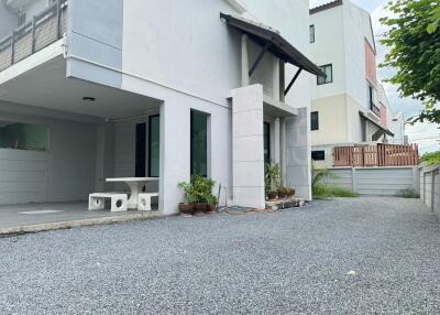 Front exterior of residential building with driveway