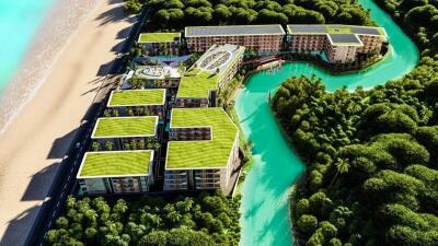 Aerial view of modern beachfront apartment complex with green roofs and a river running through the property