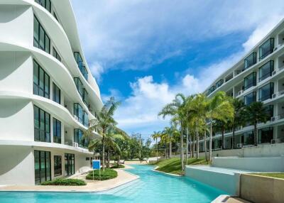 Scenic view of modern apartment buildings with a central pool