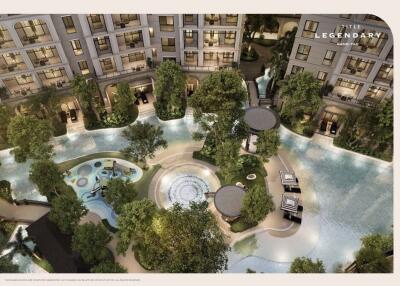 Aerial view of a luxury apartment complex with a swimming pool and garden area