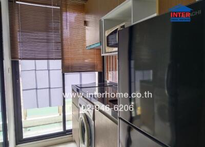 Modern kitchen with appliances and large window