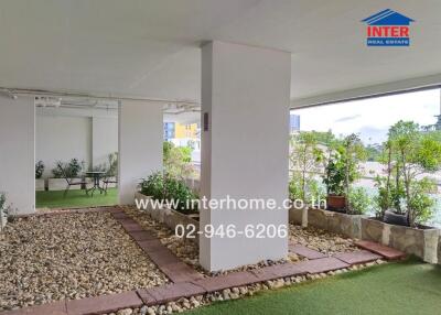 Covered outdoor area with greenery