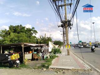 Street view near the property showing power lines and surroundings