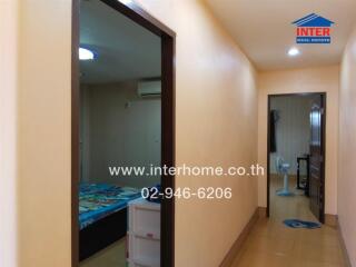 View of a hallway with bedroom and bathroom