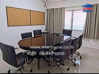 Conference room with a large table and chairs