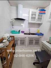 Compact kitchen with appliances and storage