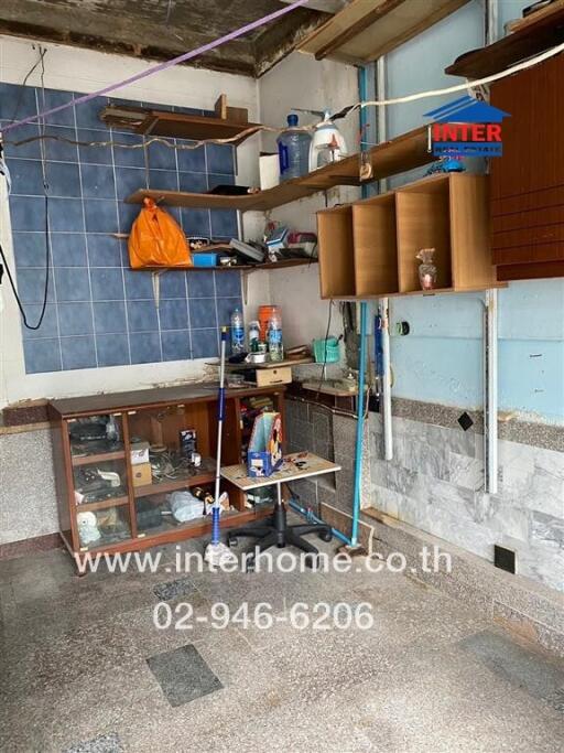 Kitchen with various shelves and cabinets