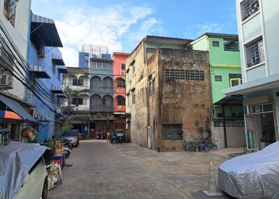 Street view with buildings and parked vehicles