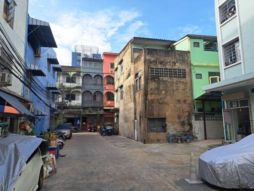 Street view with buildings and parked vehicles