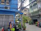 Street view of residential area with buildings and shops