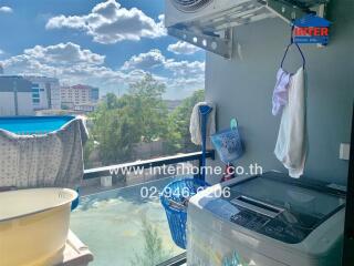 Laundry room with washing area, city view in the background