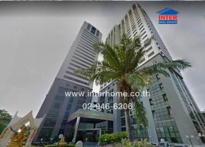 High-rise building with palm tree and contact information banner