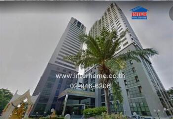 High-rise building with palm tree and contact information banner