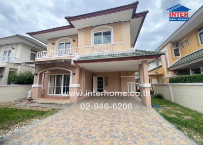 front view of a two-story house with a double driveway