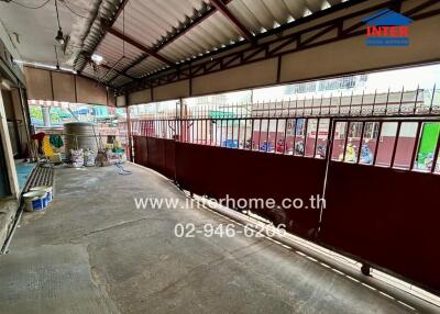 Covered outdoor area with metal gate