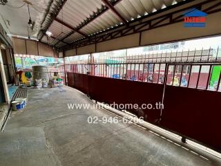 Covered outdoor area with metal gate