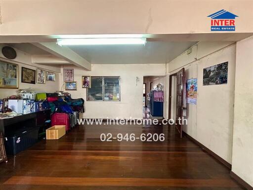 Main living area with mixed furnishings and hardwood flooring