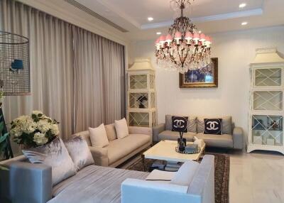 Elegant living room with chandeliers and modern furniture