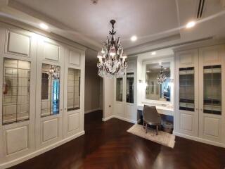 Spacious bedroom with elegant fixtures and ample closet space