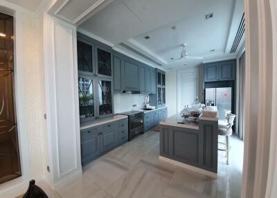 Modern kitchen with gray cabinetry and island