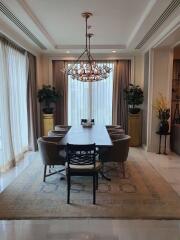 Elegant dining room with chandelier and large table