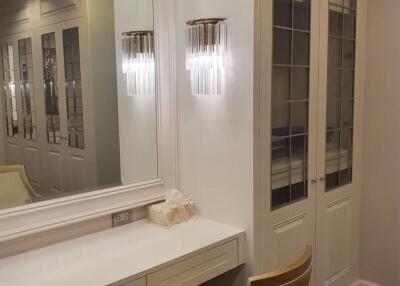 Elegant bedroom vanity area with built-in closets