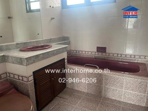 Bathroom with bathtub and sink