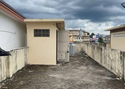 Rooftop area with cloudy sky