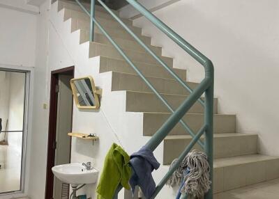 Staircase in a residential property with cleaning equipment