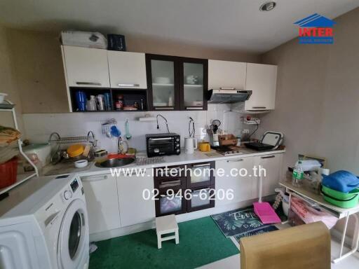 Modern kitchen with appliances and cabinetry