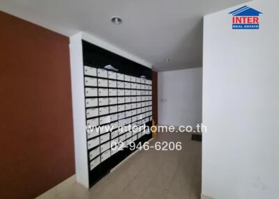 wall of mailboxes in a building lobby area