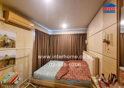 Bedroom with bed, curtains, and air conditioning unit