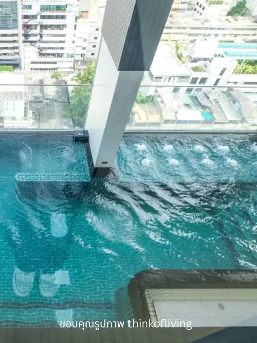 High-rise building with a rooftop swimming pool