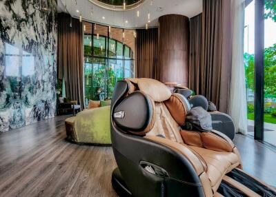 Luxurious living area with modern massage chairs and a scenic view