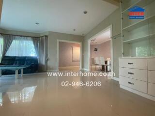 Spacious living area with a view into the dining room