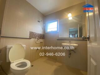 Spacious bathroom with modern fixtures and natural lighting