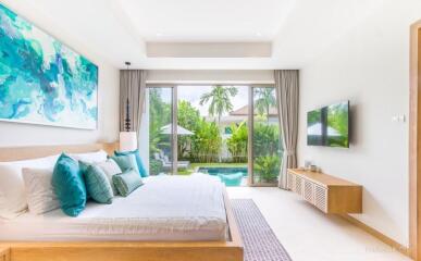 Modern bedroom with large windows and outside view