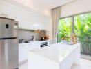 Modern kitchen with island and stainless steel appliances